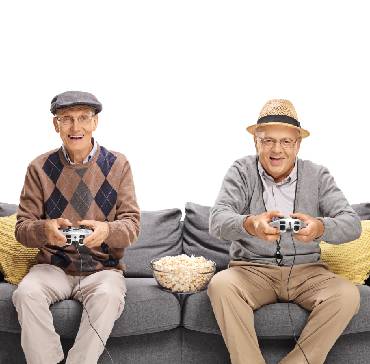 Happy old man with his firend playing video game